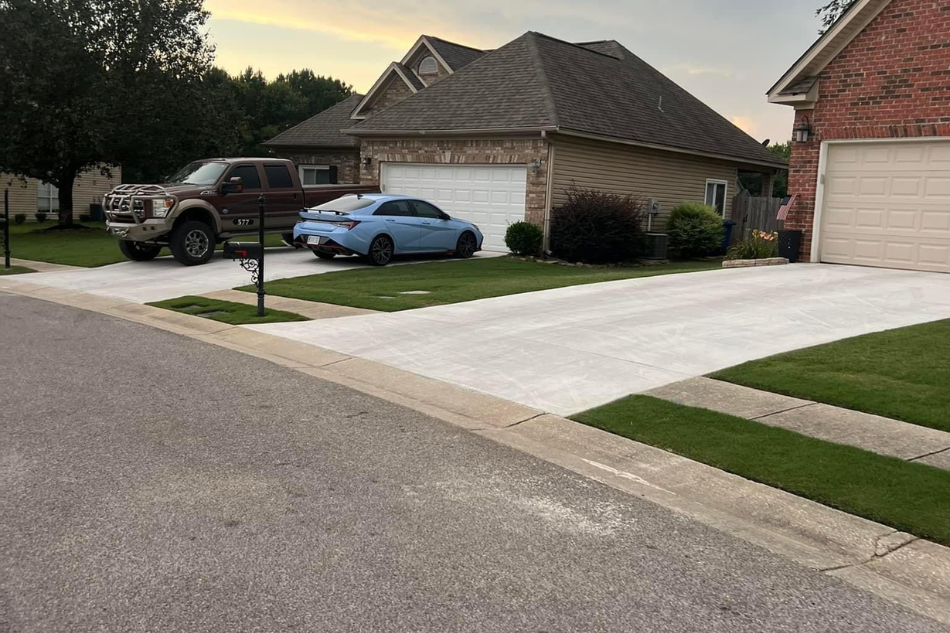 Two adjacent, beautifully completed concrete driveways for modern homes